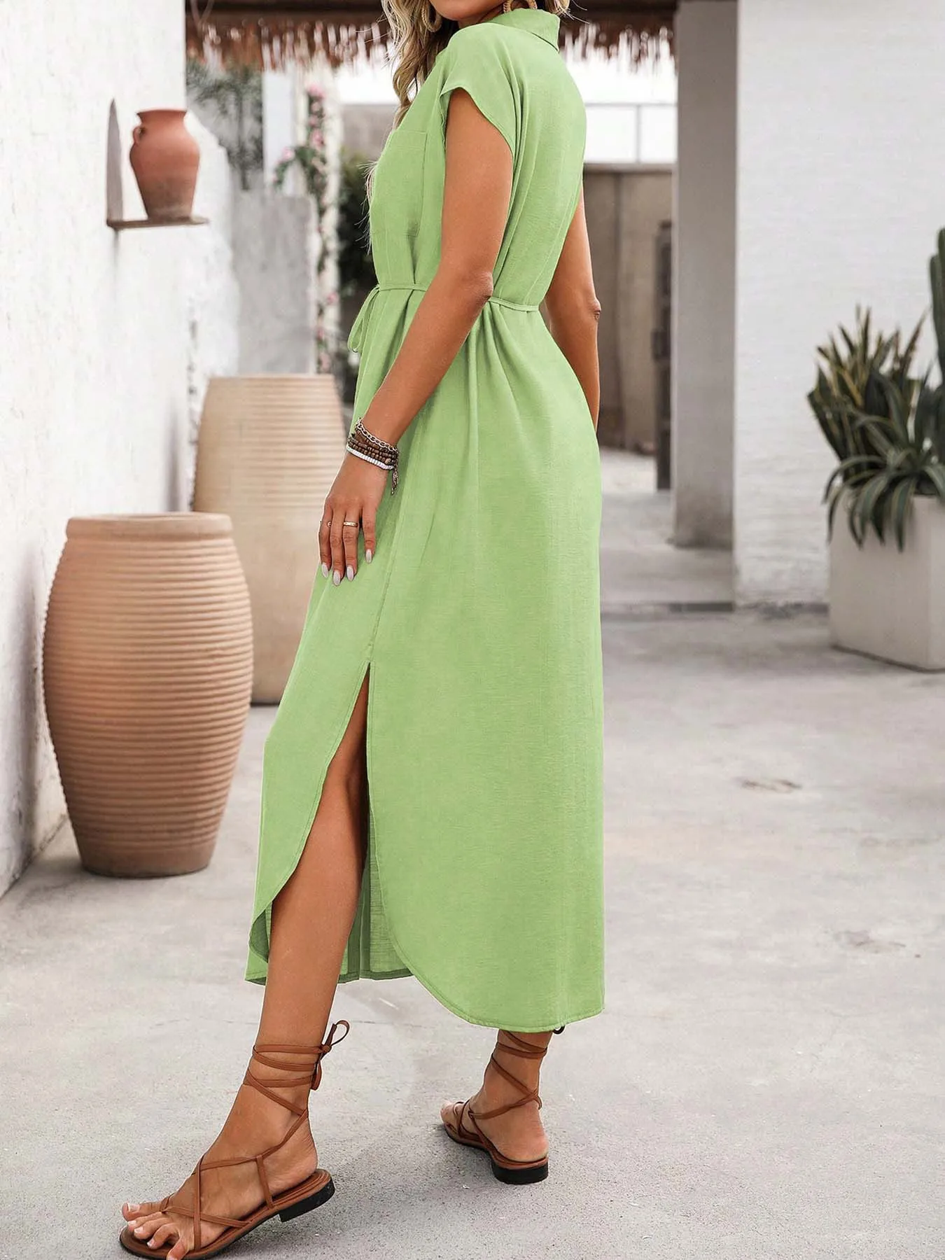 Women's Elegant Button-Front Shirt Dress with Side Slits, Featuring a Collar, Belted Waist, and Pockets.