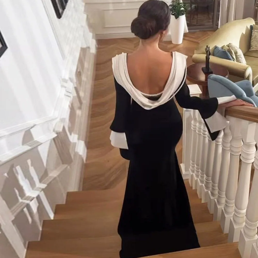 Elegante zwarte o-hals lange mouwen galajurken vloerlengte rug met kralen formele feestavondjurk