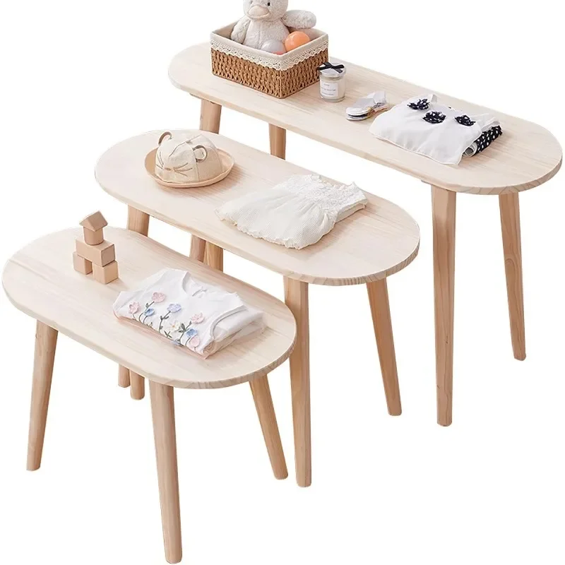 In the middle of the table in the clothing store, there are Internet celebrity solid wood display tables, children's clothing st