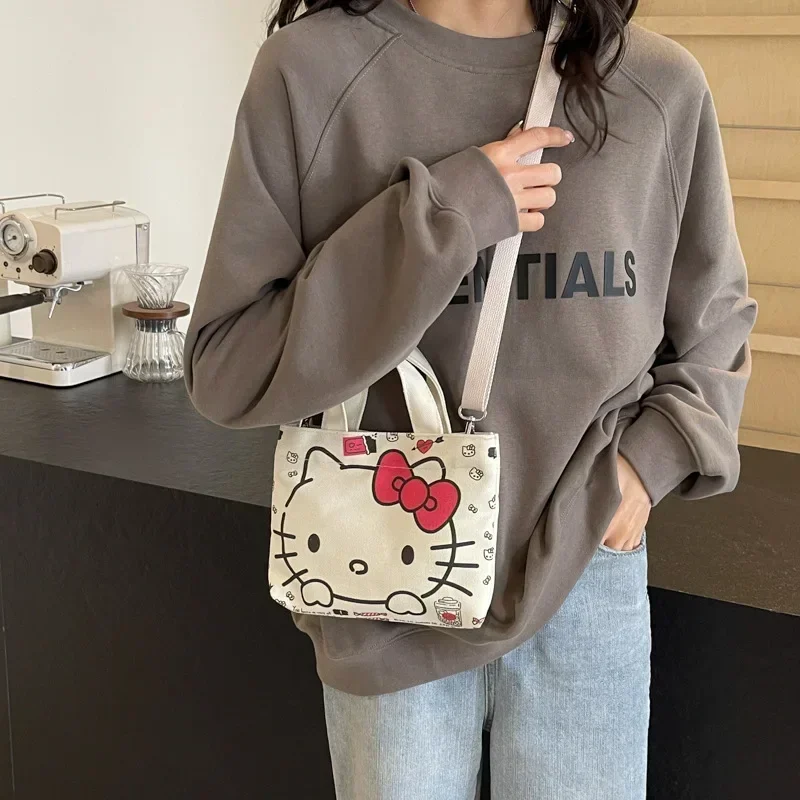 

Sanrio hello kitty cartoon canvas shoulder bag women's new fashion handbag shopping messenger bag coin purse