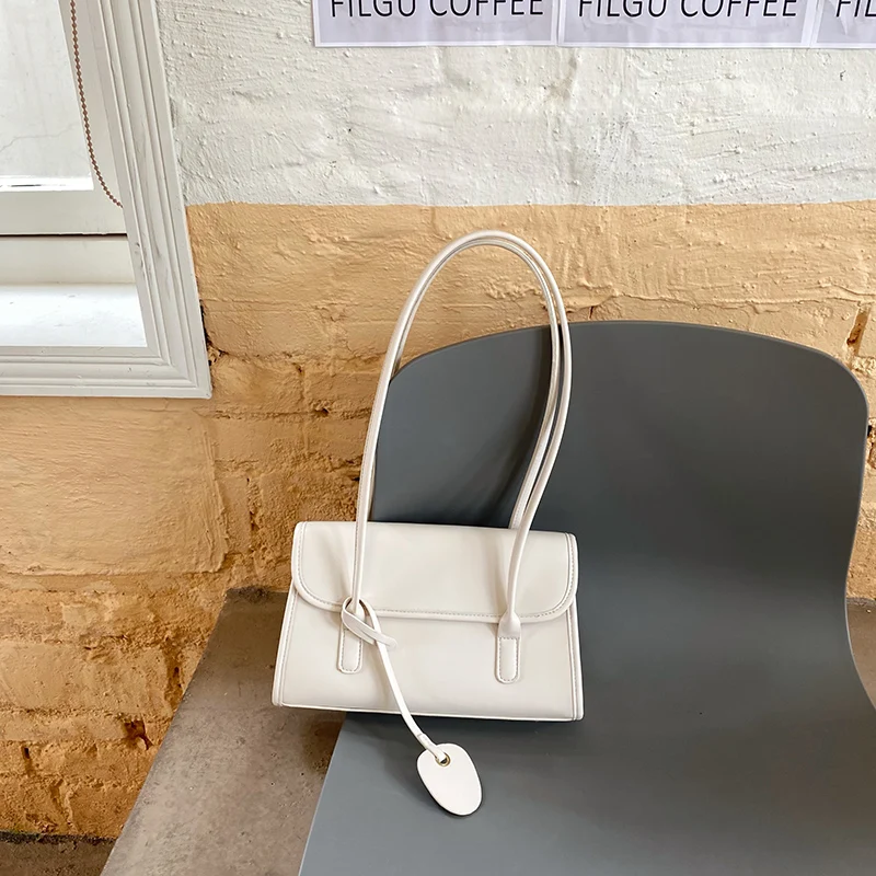 Yellow Shoulder Underarm Bag Women 2024 Spring/Summer New Fashionable French Texture PU Shoulder Bag Elegant pendants Handbag