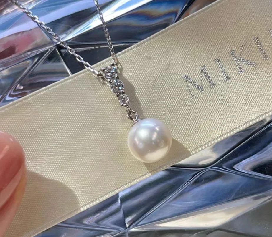 Великолепные серьги Nanhai белого и золота АААА 10-11 мм с жемчугом и подвеской 925-х годов. Великолепные серьги Nanhai белого и золота АААА 10-11 мм с жемчугом и подвеской 925-х годов.