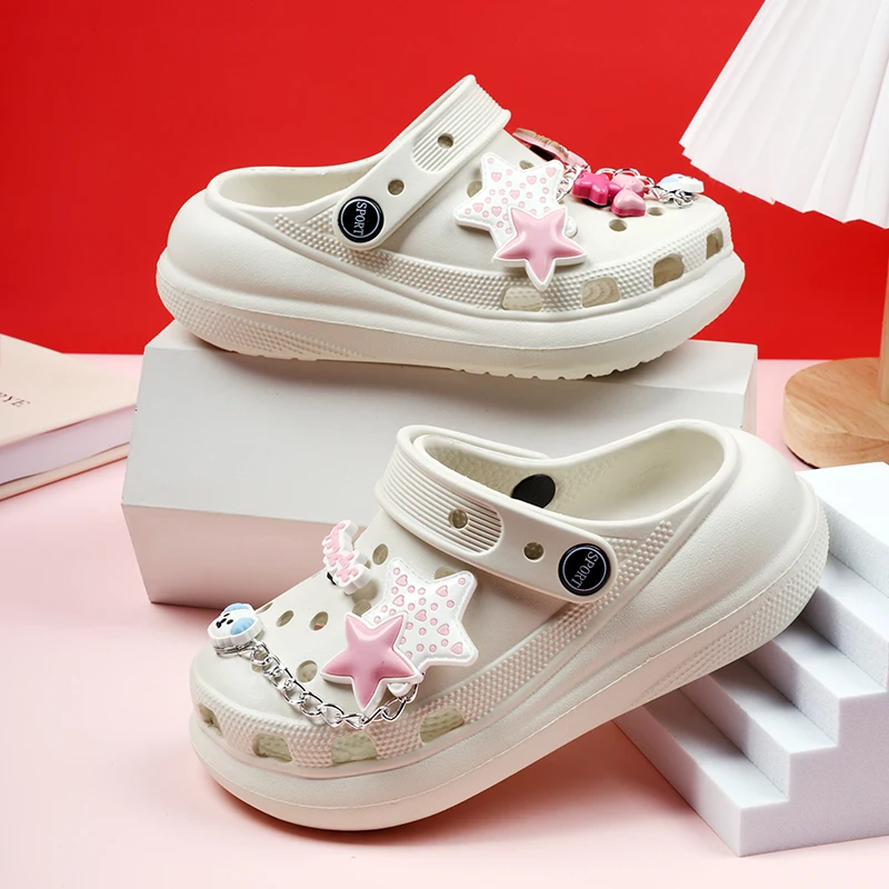A pair of cool and breathable children's summer sandals with perforated designs and star decorations on the upper. CX-6019-09