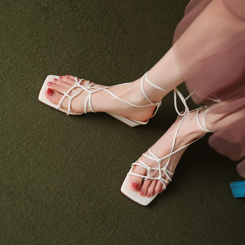 

Elegant Roman Sandals with Thin Straps & a Sculptural Heel