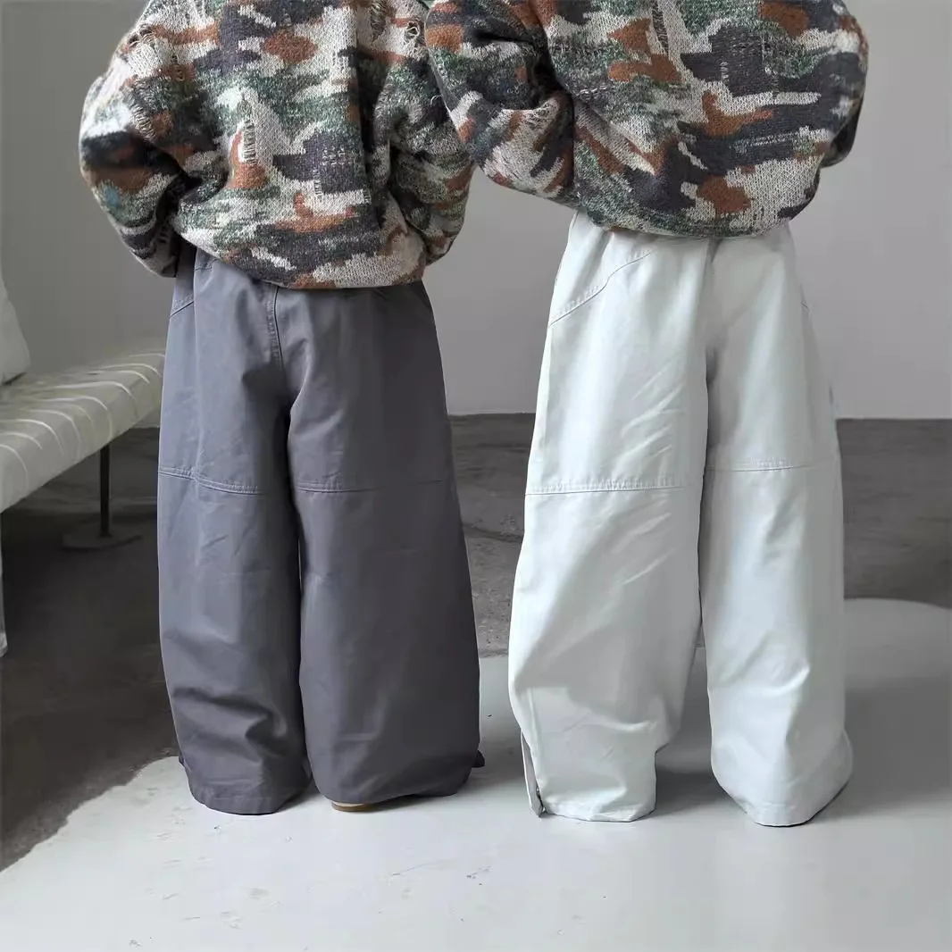 سراويل الأطفال للربيع والخريف النسخة الكورية الجديدة سراويل فضفاضة غير رسمية متعددة الاستخدامات يومية بلون سادة متعددة الاستخدامات