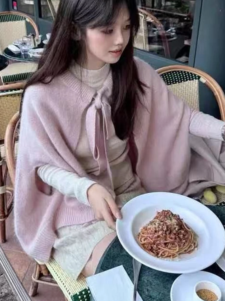 Scialle maglione coreano elegante tinta unita da donna dolce fiocco legato cardigan lavorato a maglia senza maniche moda maglieria esterna allentata