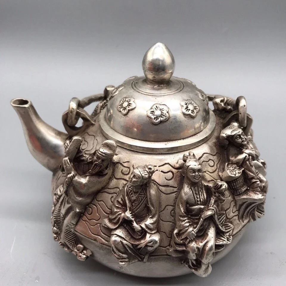 

Antique Old Objects Old Silver Eight Immortals High Lifting Handle Silver Tea Pot Seiko Made Silver Teapot Feet Silver Teapot