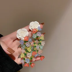 Fashionable large floral tassel earrings