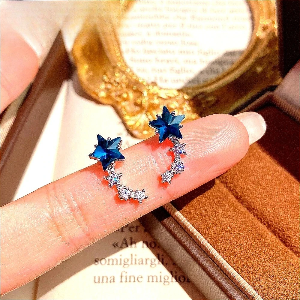 Exquisite 925 sterling silver single-row earrings for women featuring a bright blue crystal star-shaped decoration.