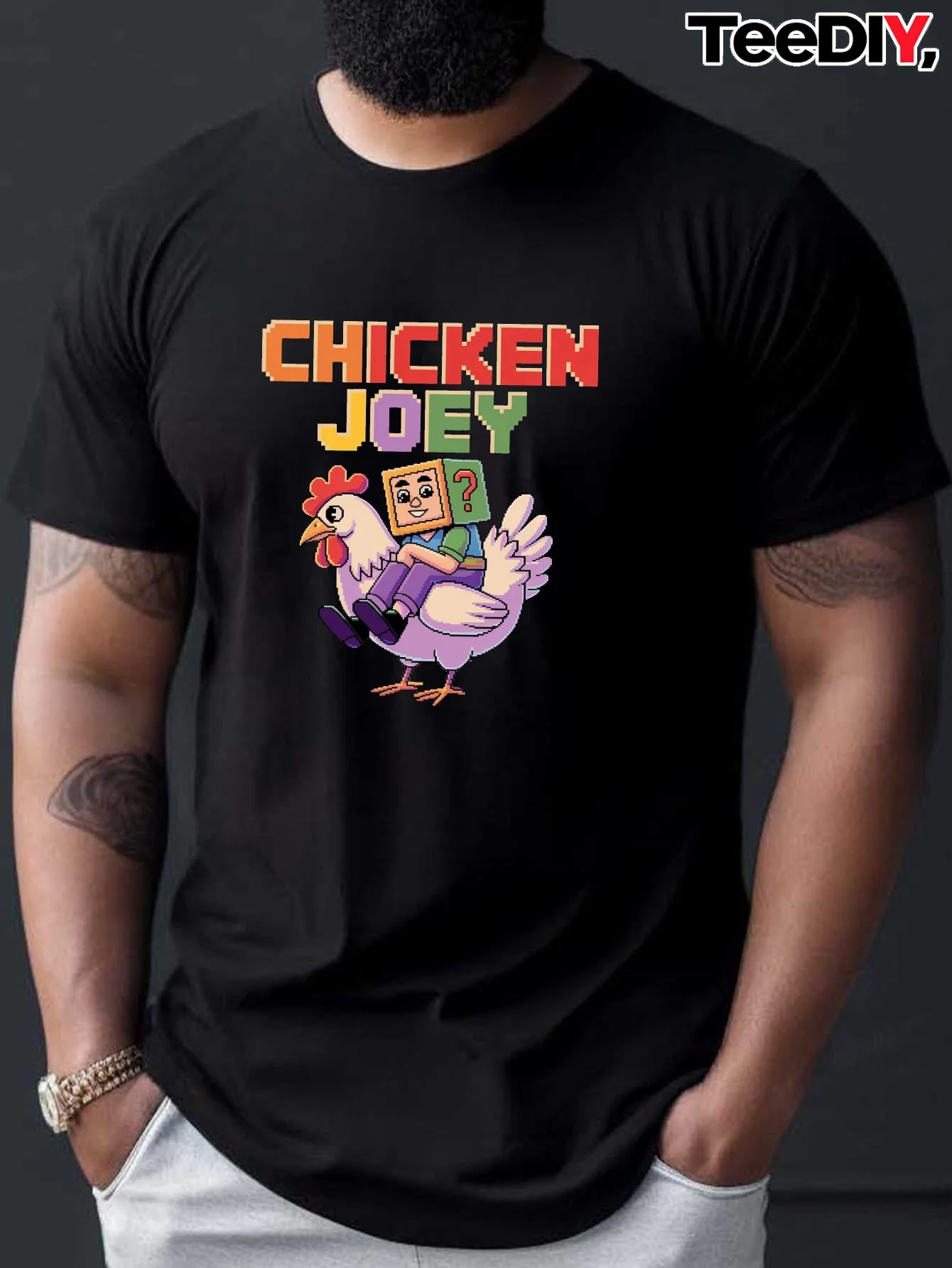 Men'S Black Graphic Tee Featuring The Text 'CHICKEN JOEY' Alongside a Purple Chicken Cartoon.
