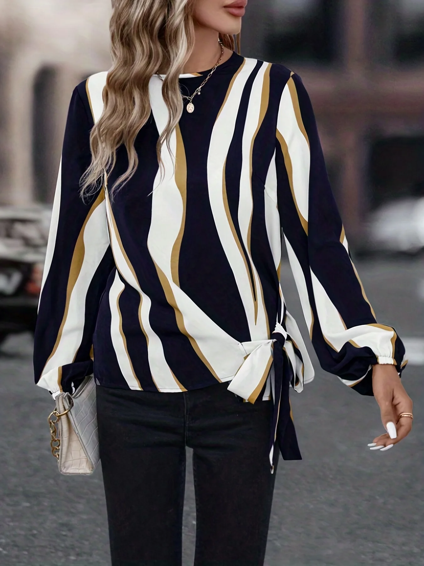 

A women's Tibetan blue wavy striped side lace-up shirt commuting style loose slimming long-sleeved top