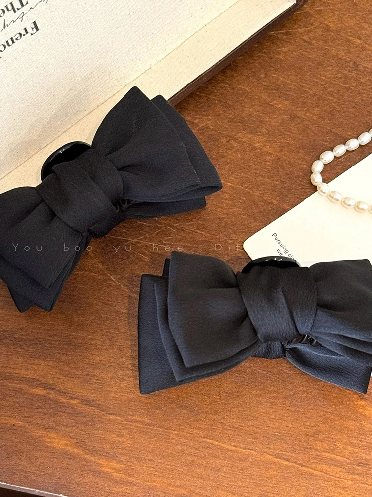 Black Bow Hair Claw for Women - Elegant and Chic, Perfect for Half-Up Hairstyles, Adds a Sophisticated Touch to Your Look.