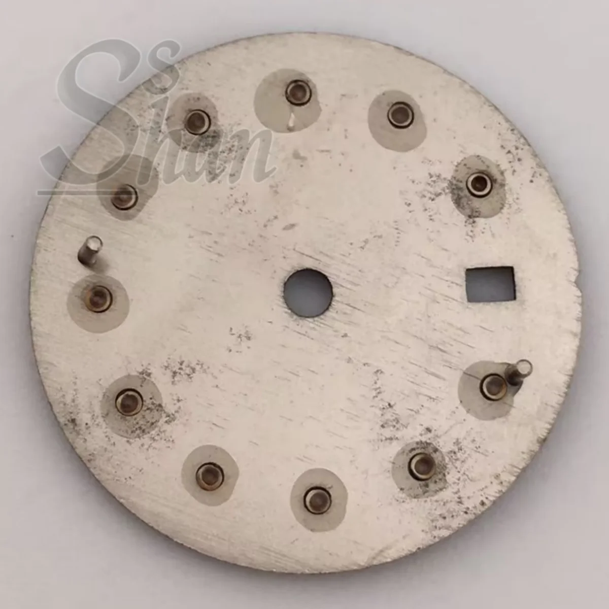 NH05 20.5mm dial with gold silver rose gold diamond indices is paired with a 26mm NH05 movement component a brown sunburst dial