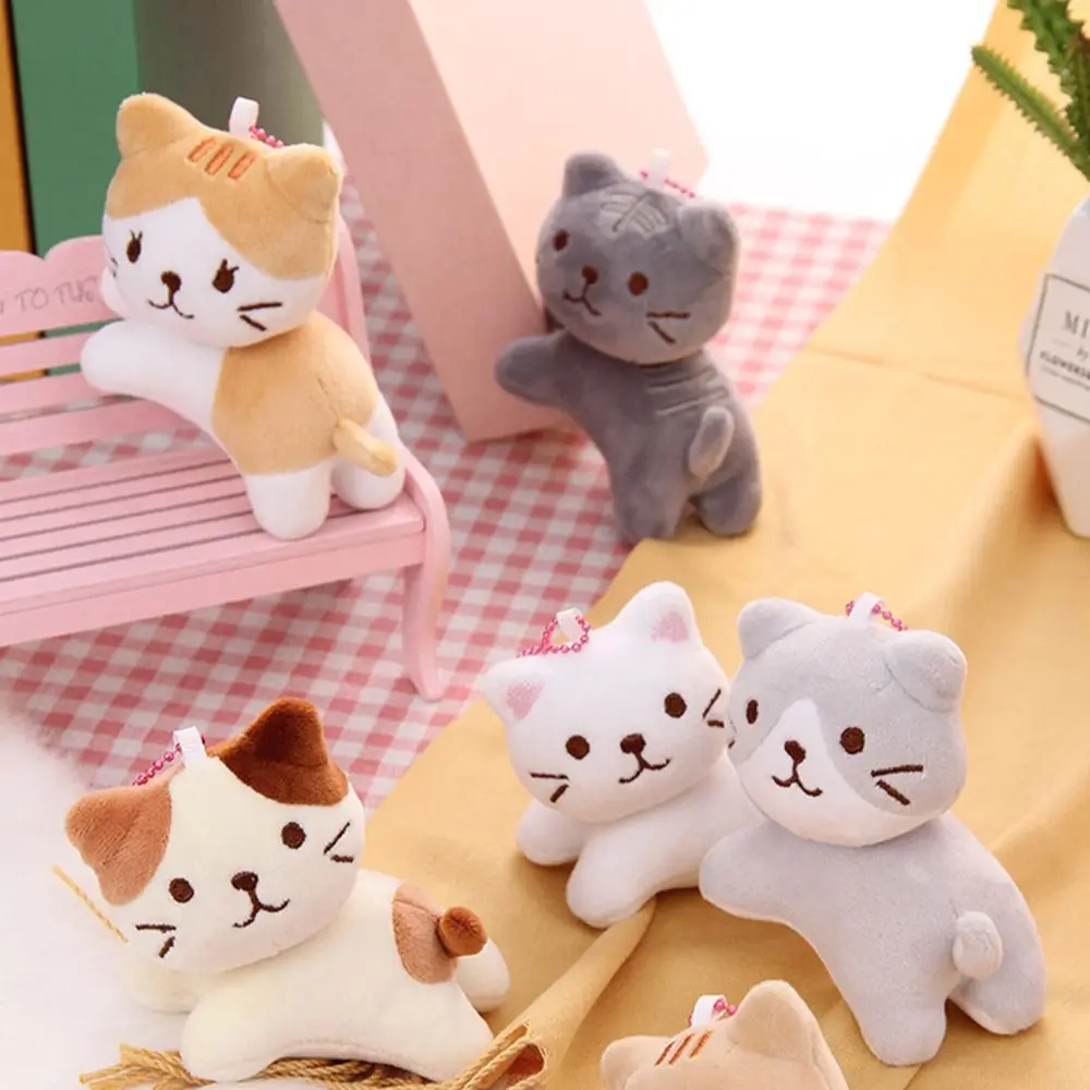 Boucle de clé chat mignon en peluche pendentif sac à dos breloques en peluche tête tordue chaton porte-clés Style coréen dessin animé poupée pendentif