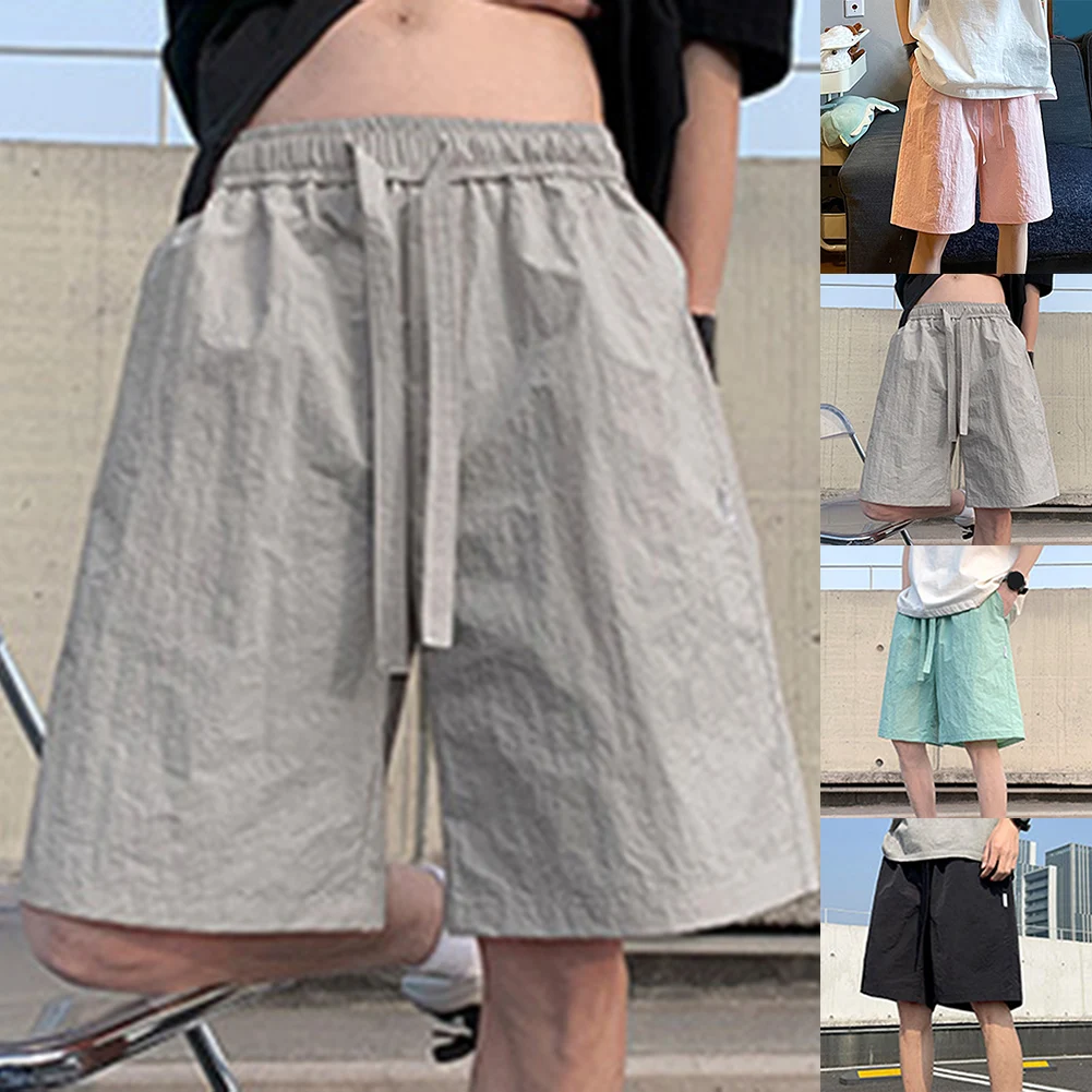 شورت فضفاض مناسب مقاس 2XL شورت رجالي رفيع لجميع المواسم يرتدي ملابس رياضية للشاطئ متوسطة الخصر لأنشطة الشاطئ