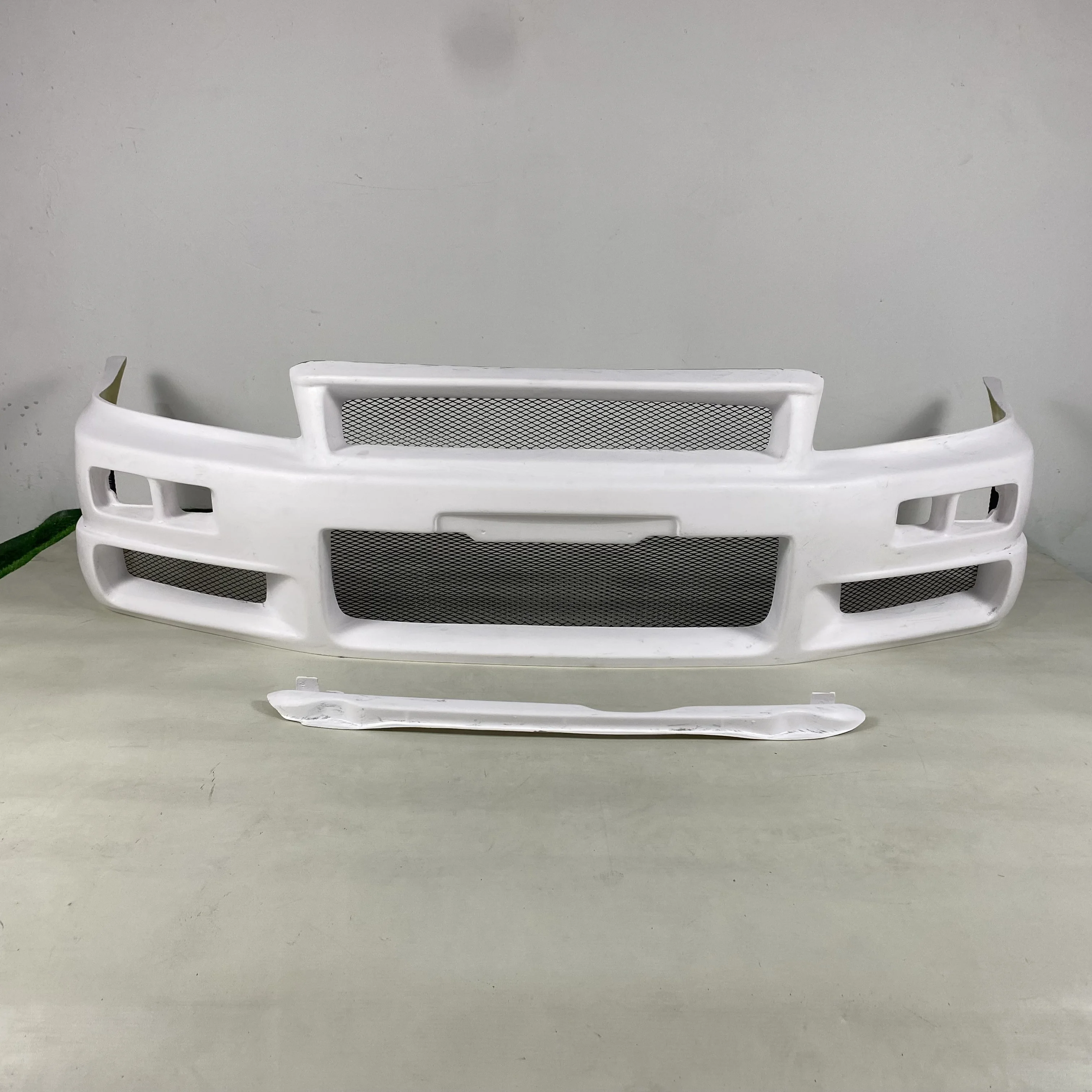 طقم هيكل السيارة FRP واقي المصد الأمامي لنيسان R34 (GTT فقط) الترقية إلى المصد الأمامي GTR ST Style (الغطاء المطلوب)