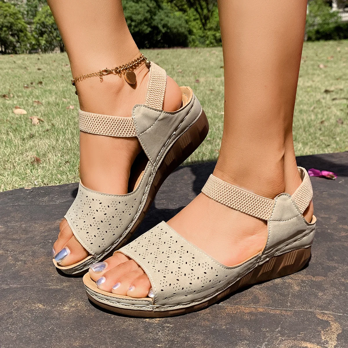 

For women, this is a stylish Roman-style fish-mouth sandal with a large wedge heel and elastic band for summer 2025