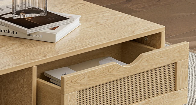 Oak coffee table drawer detail with natural woven rattan panel