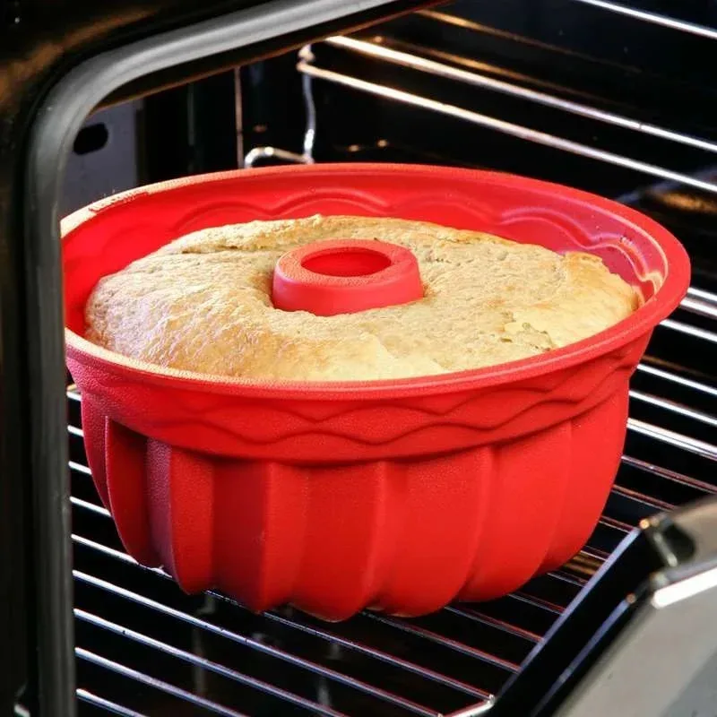 A silicone cake mold, specifically designed for circular ovens, is a household dining utensil