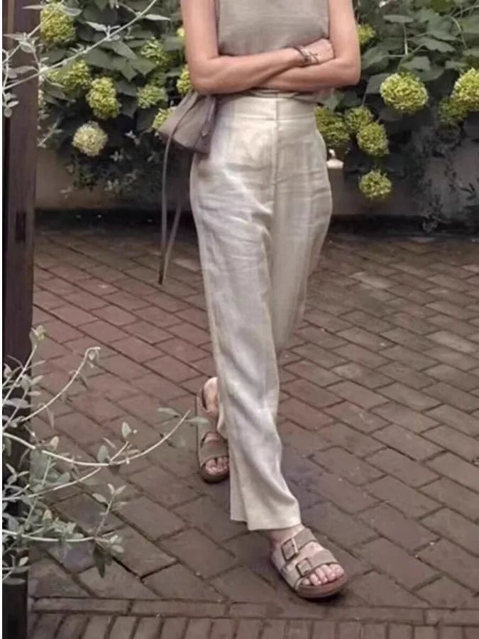 بنطلون نسائي واسع الساق بأسلوب ياباني عتيق، فضفاض وعملي، يمنح مظهراً نحيفاً، بخصر عالٍ وقماش كتان منسدل، قصة مستقيمة بطول تسع...