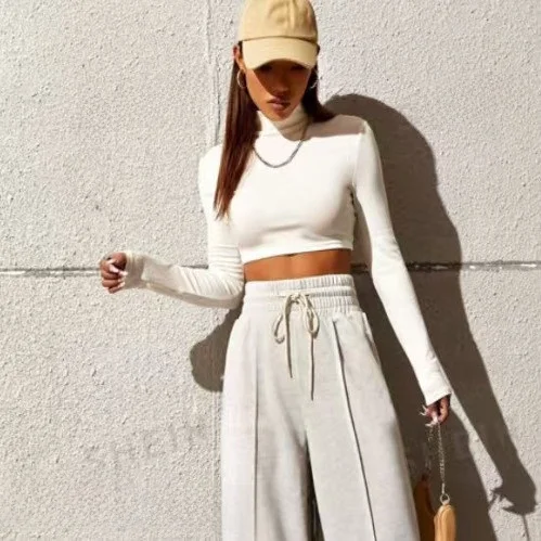 تي شيرت نسائي قصير بأكمام طويلة وياقة عالية، قميص قصير يكشف البطن، ضيق ومناسب للجسم بلون موحد، موضة الربيع #1