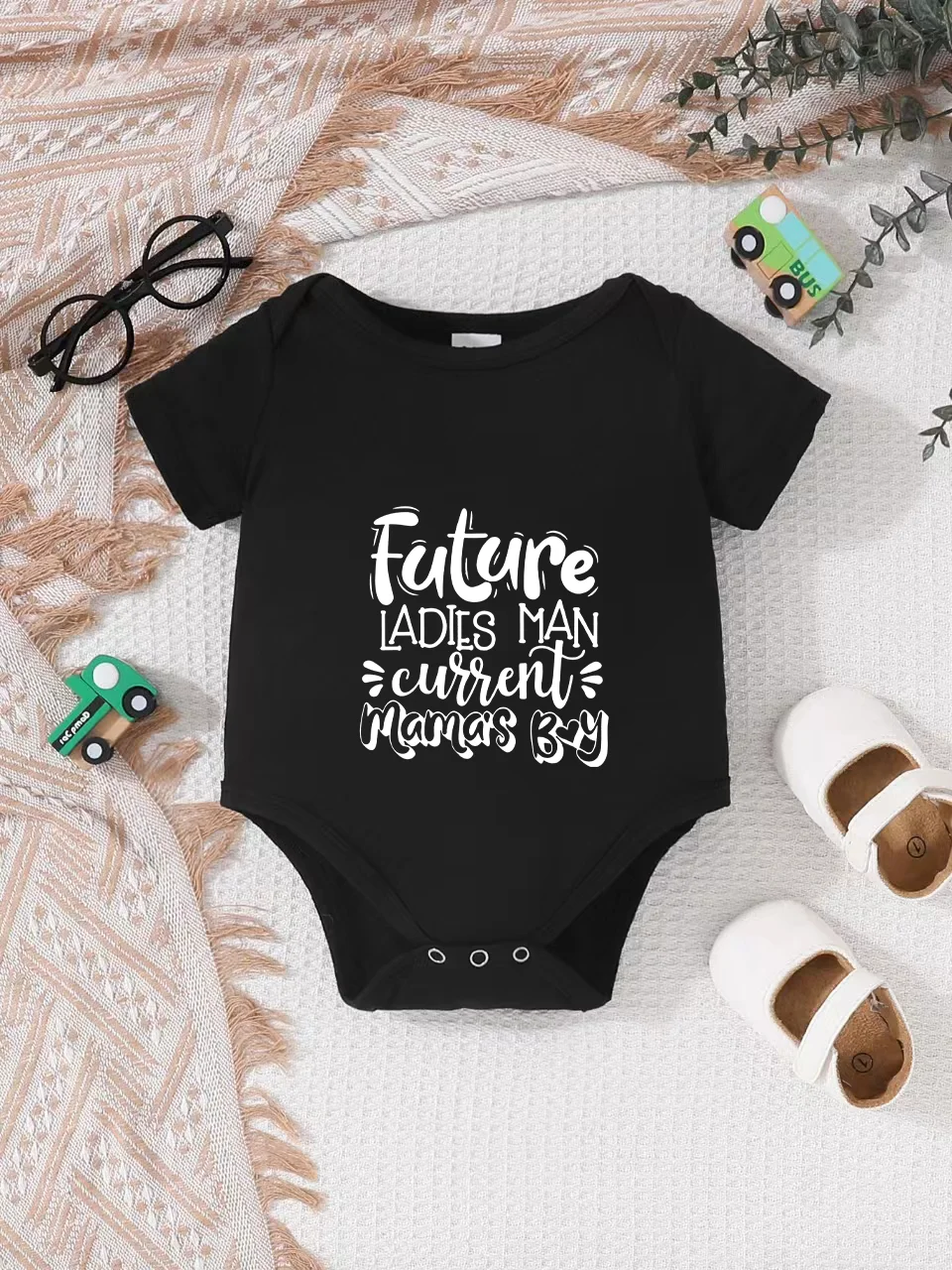 Playful letter-printed baby short-sleeve triangle bodysuit. Button closure for easy dressing