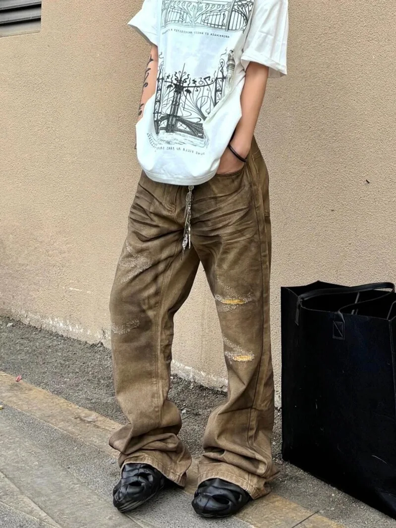 American High Street Design Ripped Micro Flared Denim Jeans Men Women 2026 New Vintage Oil Stained Floor-Length Pants