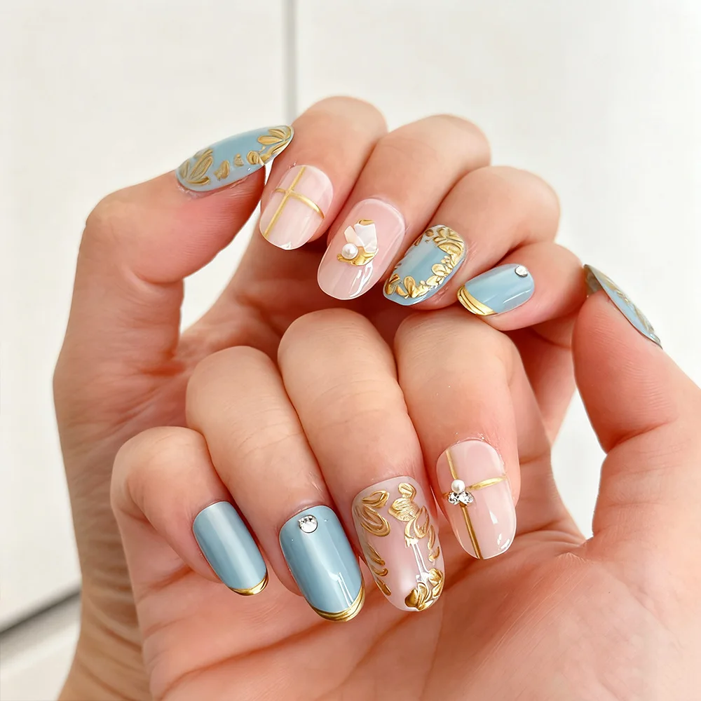 

24pcs Sky Blue Press-On Nails with Gold Border, Rhinestones, Petals & Grid Patterns, Medium Oval Shape, Assorted Sizes