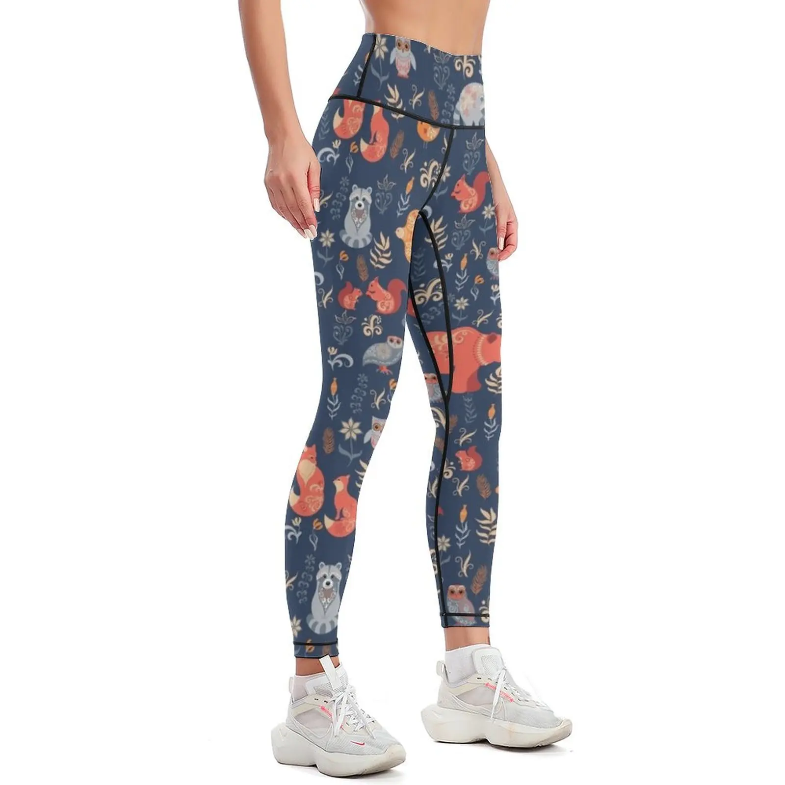 Fairy-tale forest. Fox, bear, raccoon, owls, rabbits, flowers and herbs on a blue background. Leggings