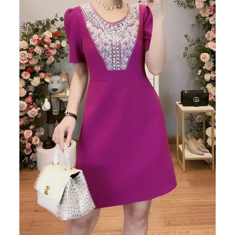 Lace stitching dress female autumn 2024 new high-grade sense nail bead waist cover belly slim temperament black A-line skirt.