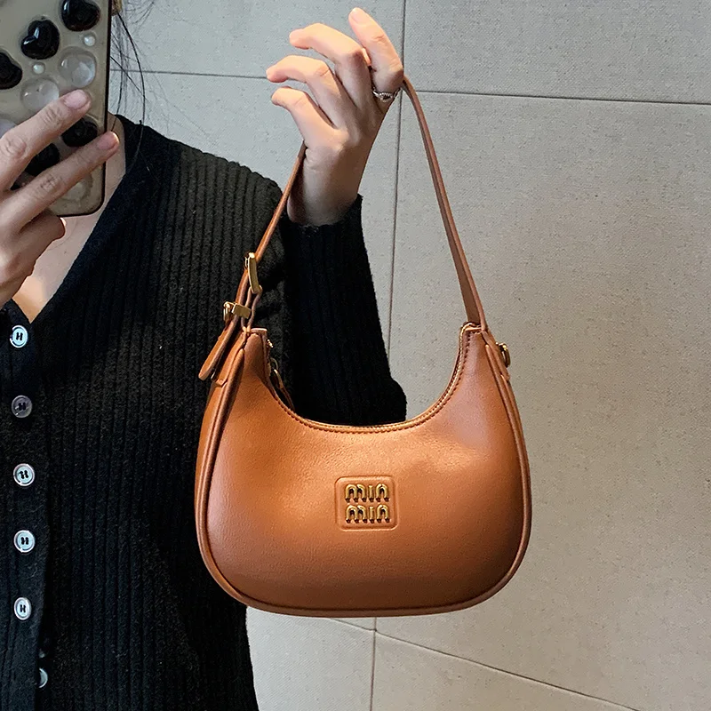2025 new designer bags crescent-shaped bags, dumpling-shaped bags, commuter cross-body bags, hand-held bags over the shoulder