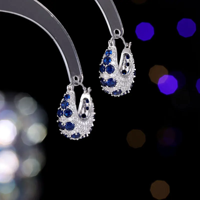 

High-end earrings, women's colored zircon, exquisite, light luxury, niche design sense earrings, and trendy circle ear buckles
