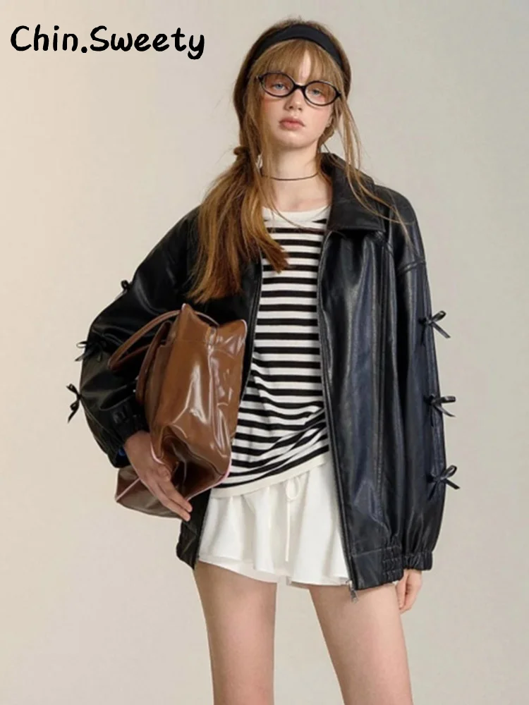 Damska kurtka skórzana z zamkiem błyskawicznym, czarna, z klapami, długim rękawem, kieszeniami, uniwersalna, elegancka odzież wierzchnia na jesień 2025, idealna do pracy.