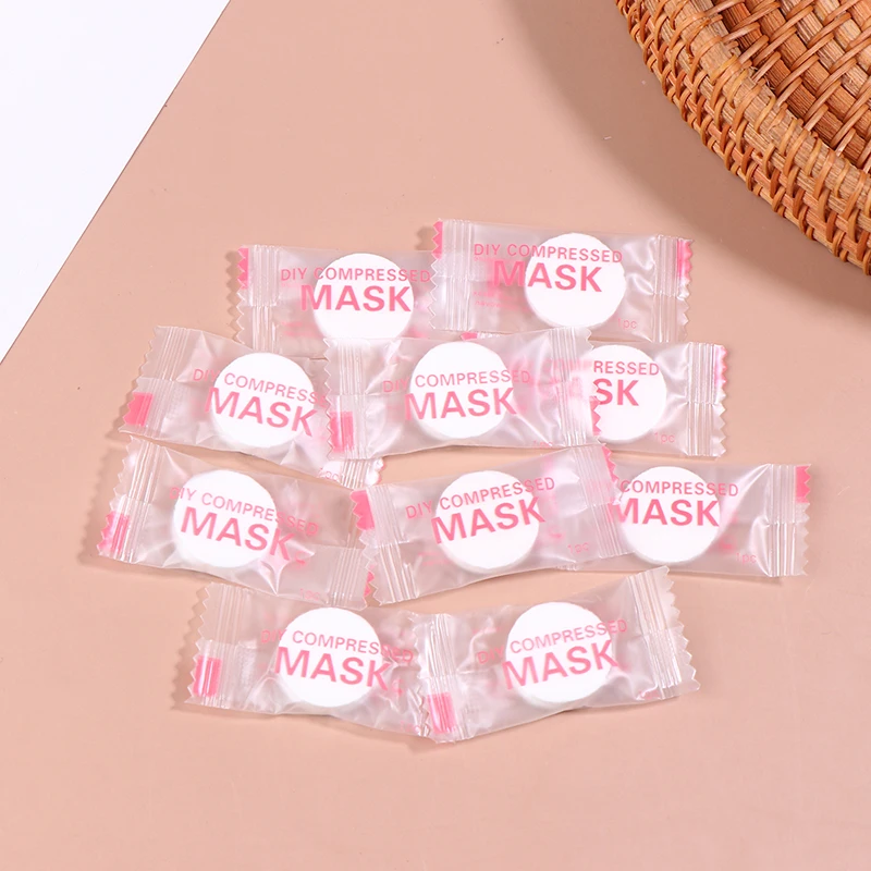 Masque Facial compressé jetable, 50/100 pièces, Portable, Non tissé, serviette pour le visage, pièces de monnaie, tissus enveloppés en coton, nouveauté