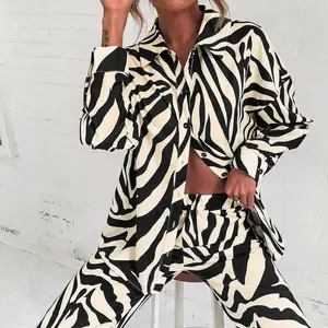 مجموعة السراويل المطبوعة بأكمام طويلة من القماش الكامل العصري 2022 قميص خارج الكتف عبر الحدود الإصدار الساخن أفضل 12 مجموعة اجتماعية من السراويل والبلوزات للمبيعات - رقم 2