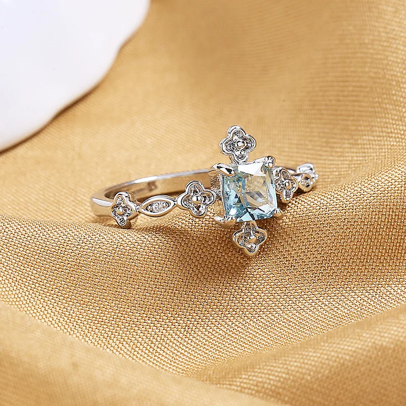 Delicate square topaz ring women's European and American fashion diamond-encrusted blue zircon flower ring jewelry