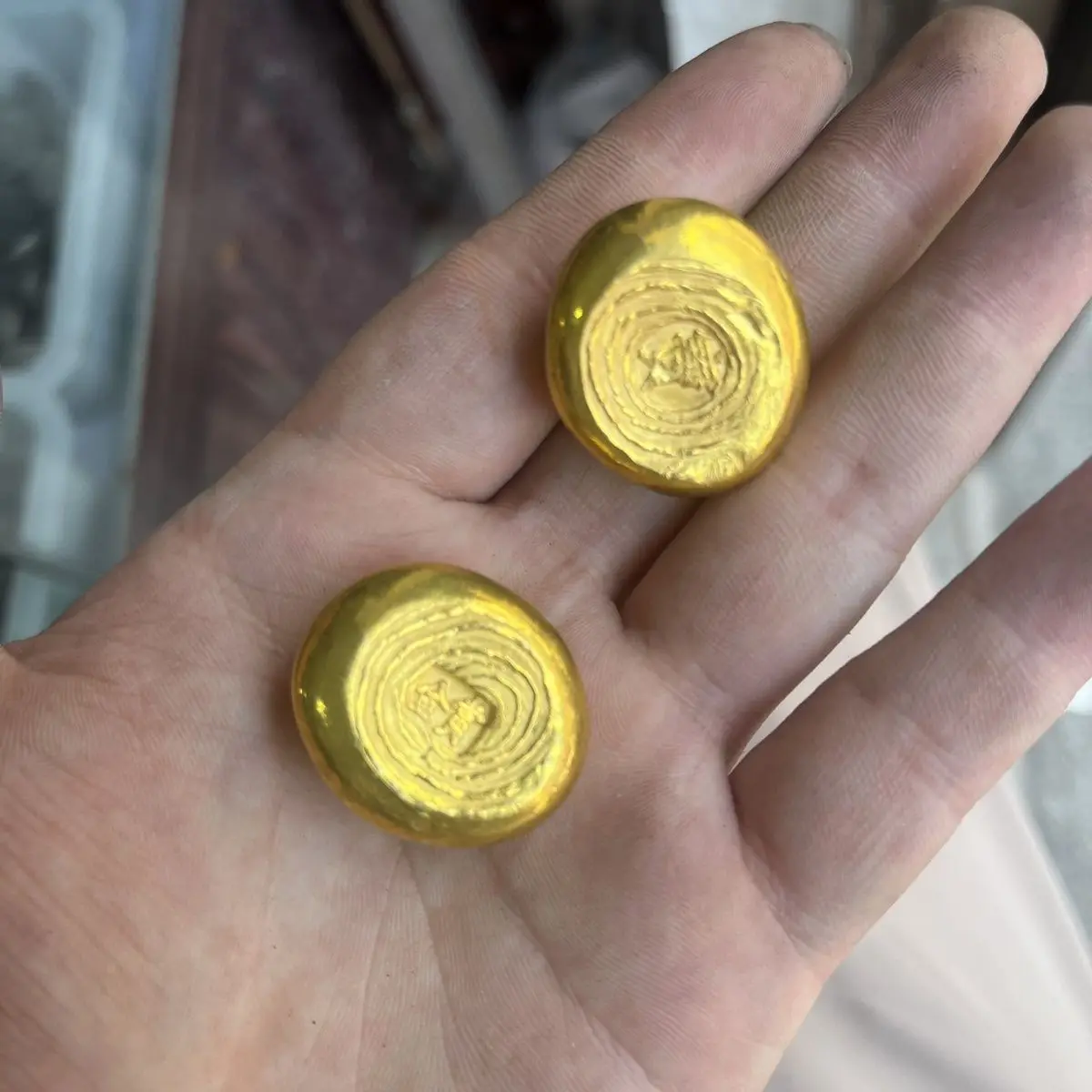 

Antique gold ingots and gold bars. Golden beans, golden nuggets simulation