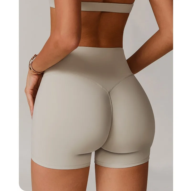 Pantaloncini da yoga transfrontalieri a vita alta e sollevamento dei fianchi indossati su pantaloncini sportivi attillati, dimagranti e da corsa per un look femminile