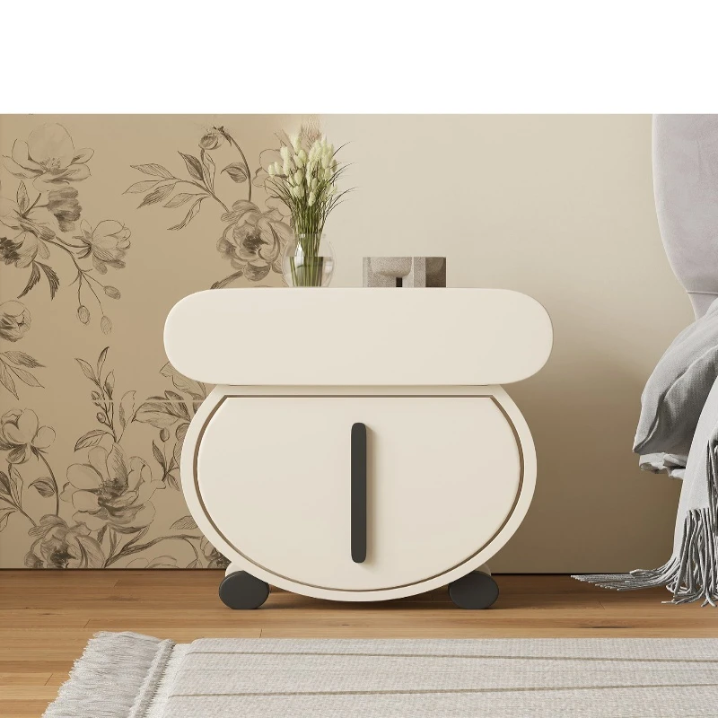 

Cream style designer special-shaped art bedside table medieval high-end Internet celebrity paint bedside table