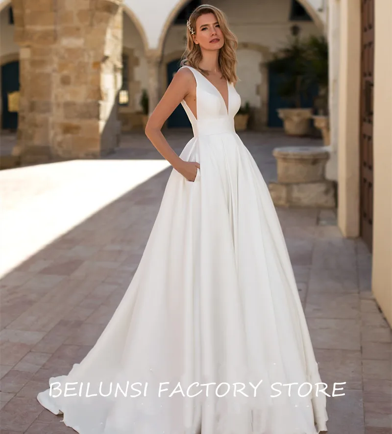 Simple Vestidos De Noiva สีขาวซาตินชุดแต่งงาน2022 A-Line V คอกระเป๋าราคาถูก Backless Robe De Mariée สำหรับ brides