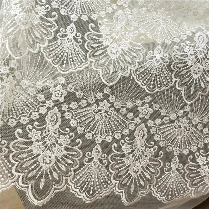 

Ivory lace fabric with sequins, embroidered tulle fabric, wedding gown fabric with scallop