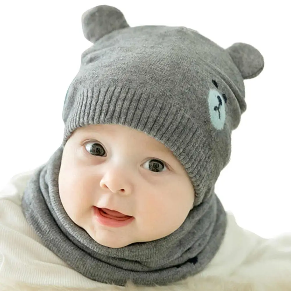 Set of hat and knitted scarf for cold, for boy from 0 to 6 months. Baby winter hat. Beanies little bears