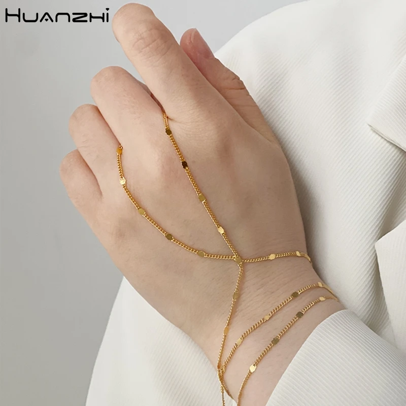 HUANZHI 2022 New Creative Tiny Gold Color Link Chains Mittens Bracelet Finger Rings For Women Connecting Hand Harness Bracelets