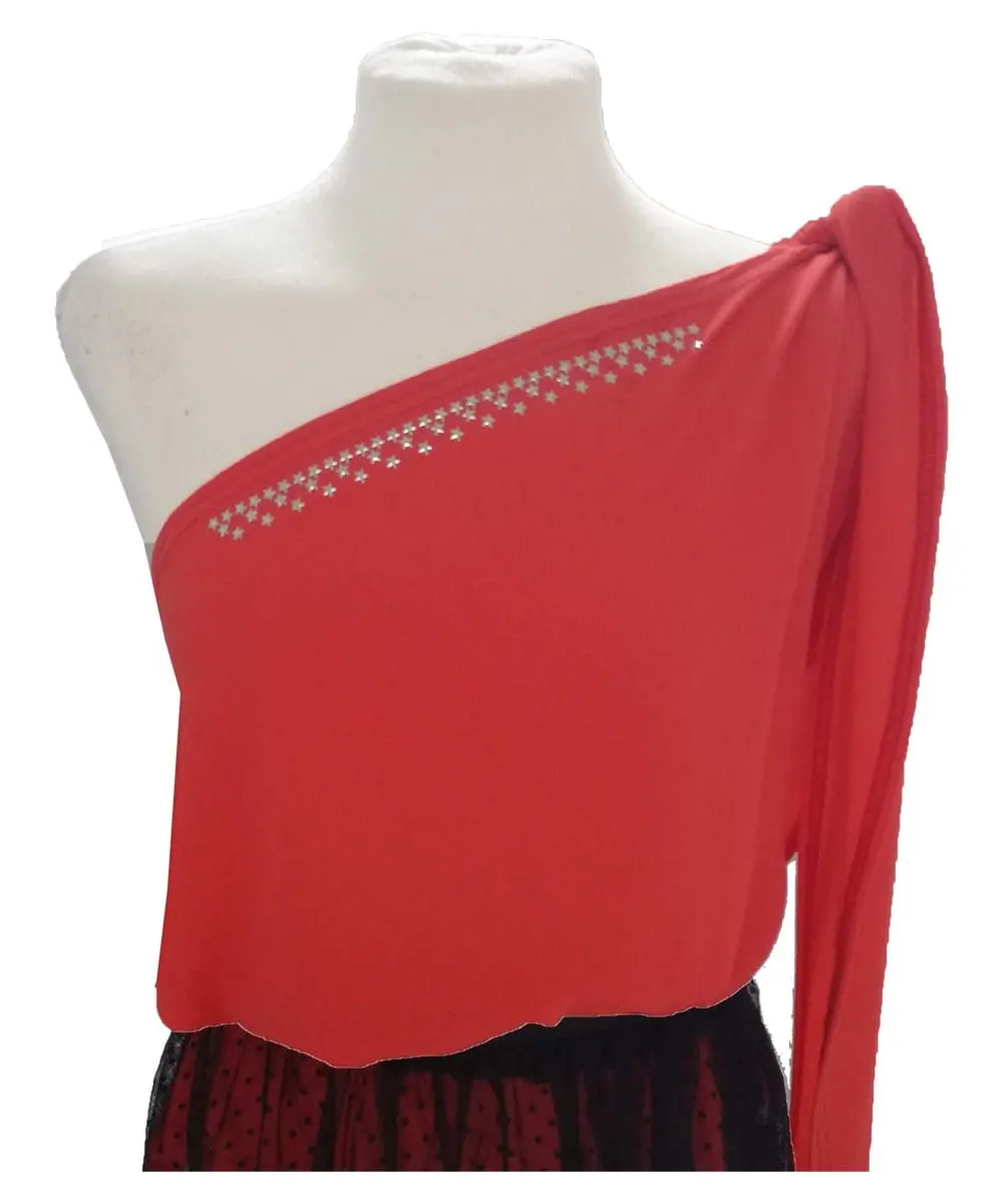 Asymmetric blouse of young woman. Orange blouse with big bow on the shoulder. Non-transparent crep fabric