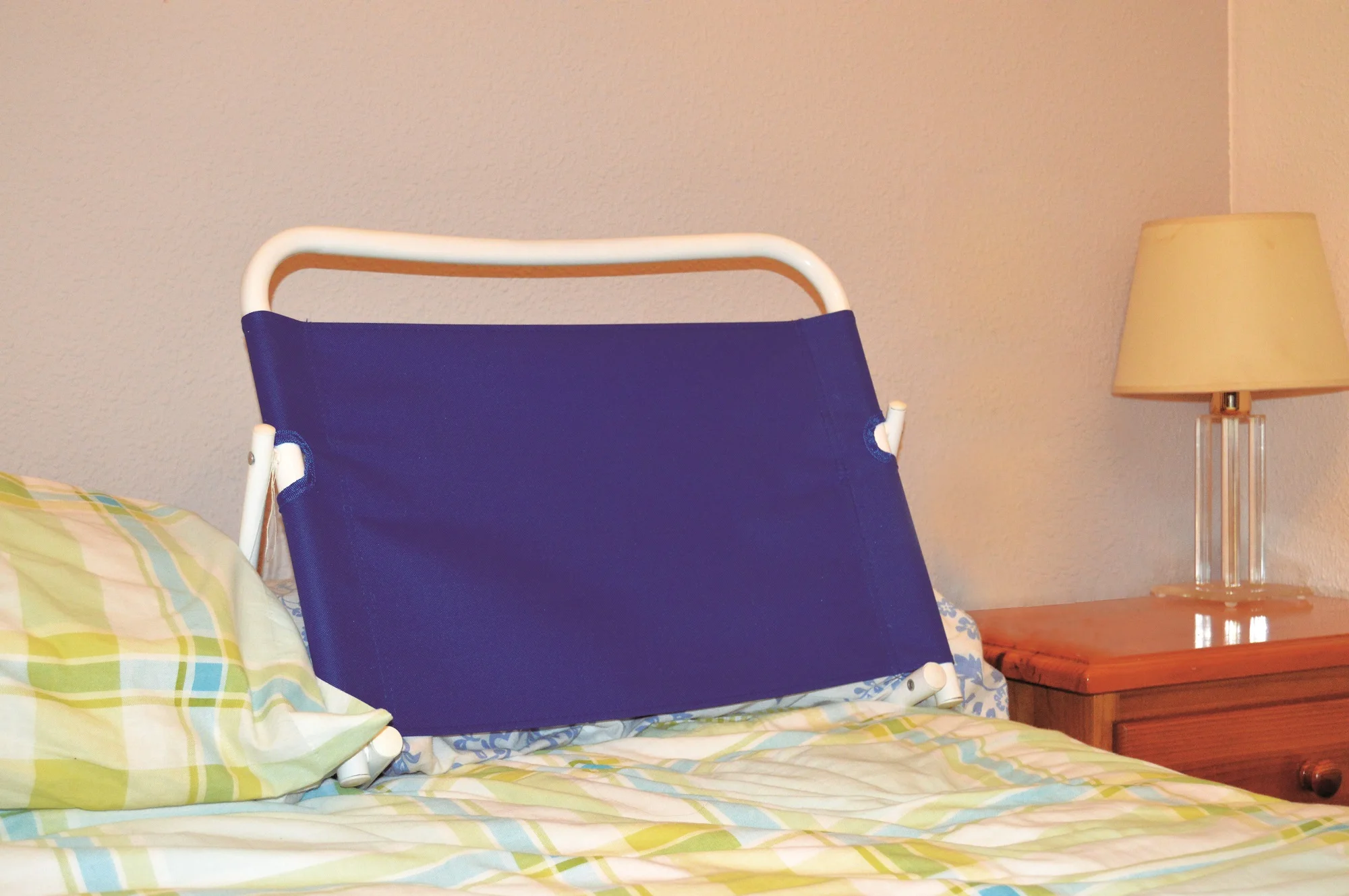 JOCCA blue adjustable backrest for bed, pool or beach. Allows bedridden people to be able to perform tasks comfortably.