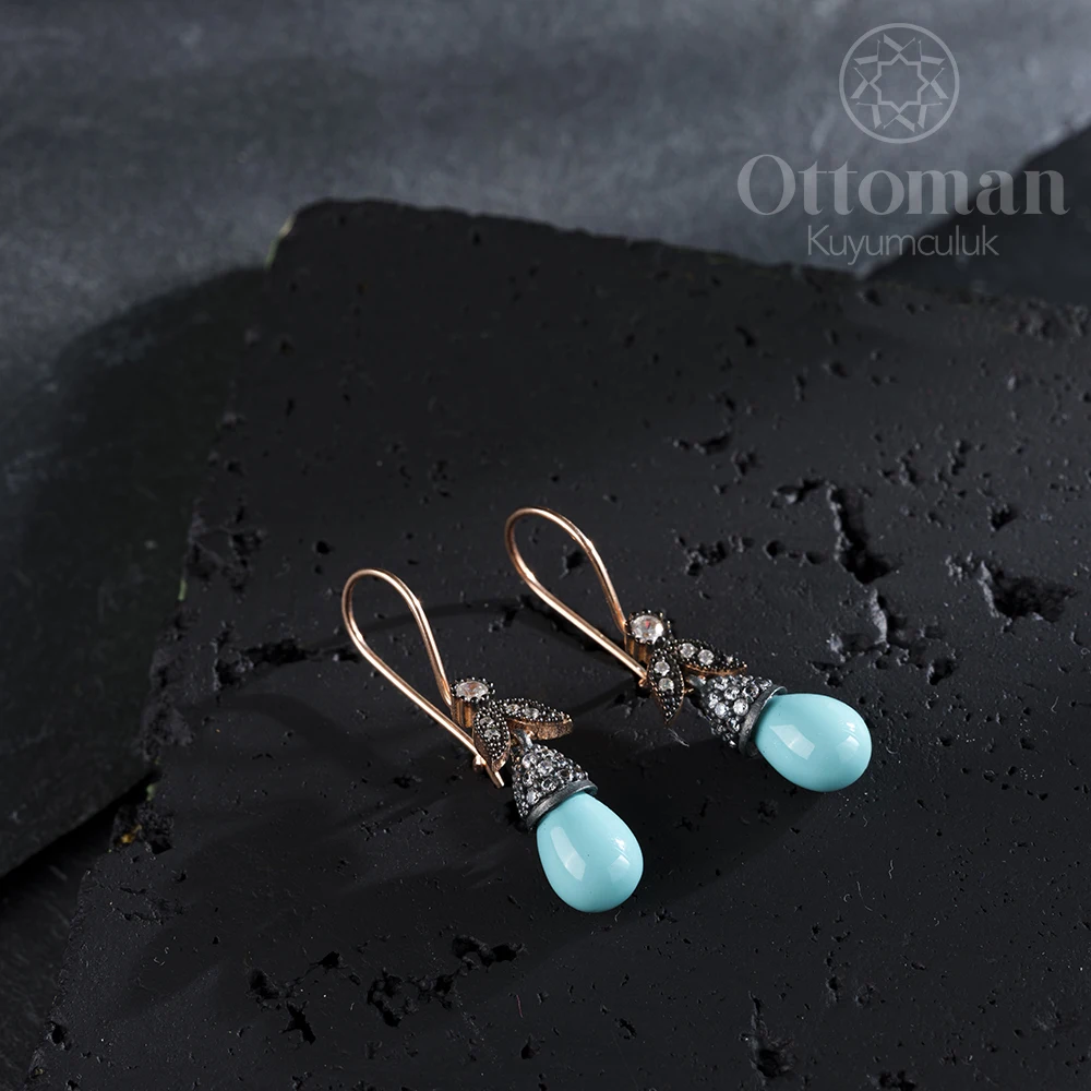 

Turquoise Women's Silver Earrings Turquoise stone in the form of drops was used in our silver rose plated earring.