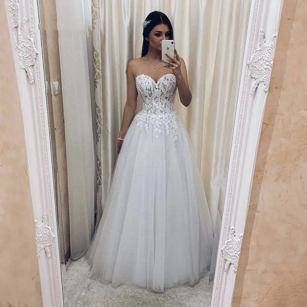 

Romantic Beach Wedding Dress 2024 Sweetheart Sleeveless Sexy Backless A Line Tulle Bridal Gown White Lace Applique Bride Dress