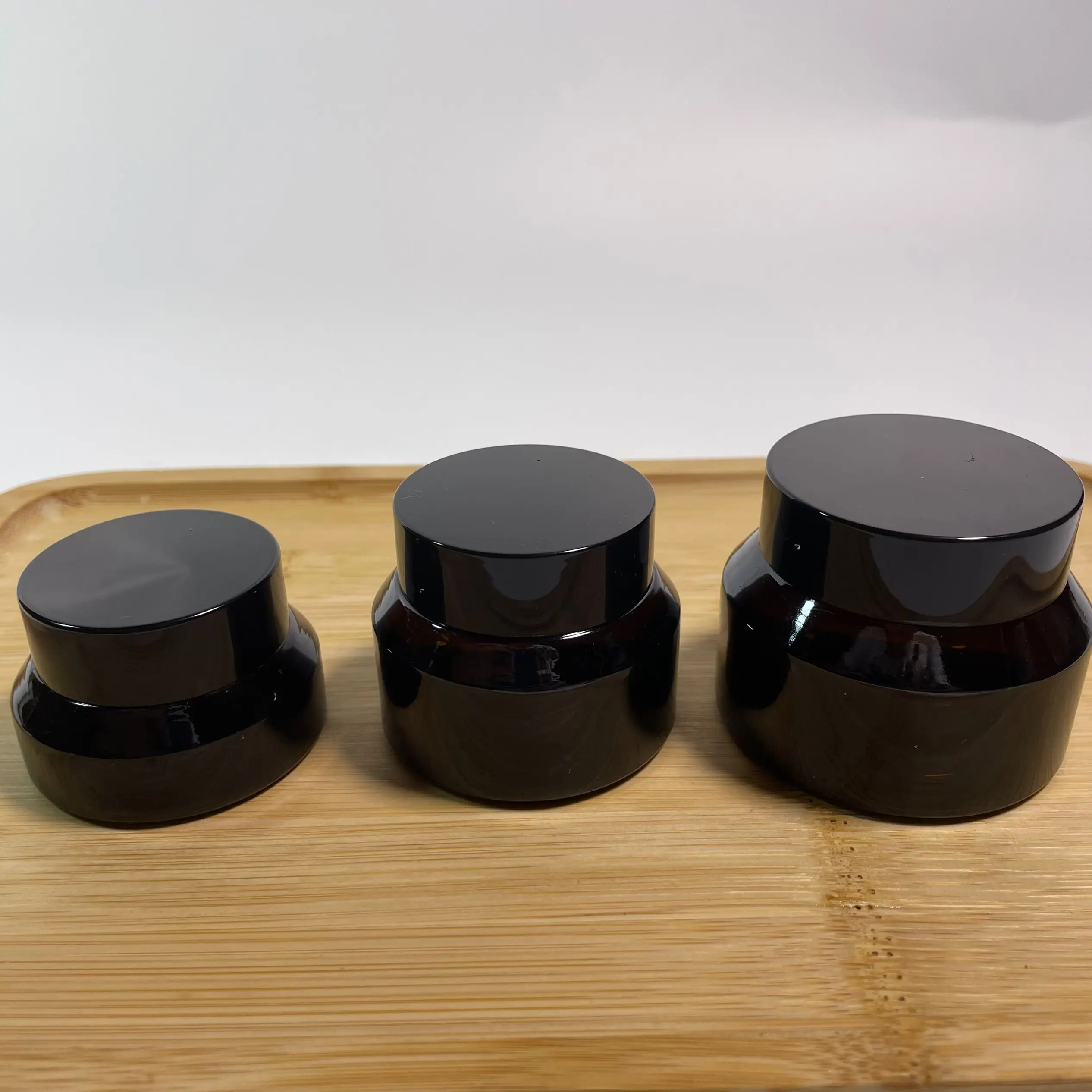 

Wholesale 15g 30g 50g Shiny Black Amber Brown Glass Cosmetic Jar Pot Face Cream Bottles Skin care Container Makeup Storage Vial